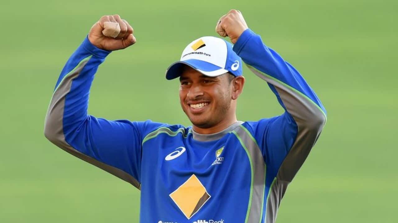 Australian cricketer Usman Khawaja gestures during a training session at the Gabba in Brisbane, Tuesday, Dec. 13, 2016. The first day-night Test Match between Australia and Pakistan at the Gabba begins Thursday. (AAP Image/Dan Peled) NO ARCHIVING