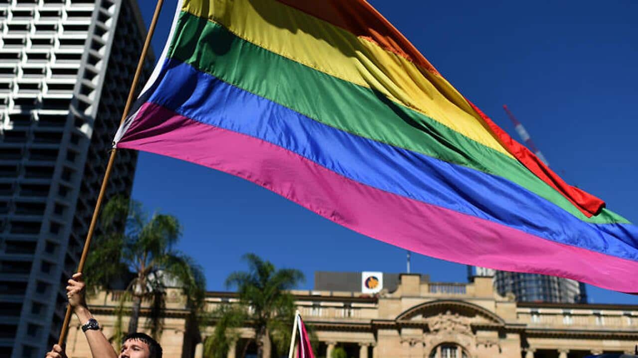 Members and supporters of the LGBTI community march through central Brisbane, Sunday, May 15, 2016. The march commemorates the International Day Against Homophobia and Transphobia. (AAP Image/Dan Peled) NO ARCHIVING