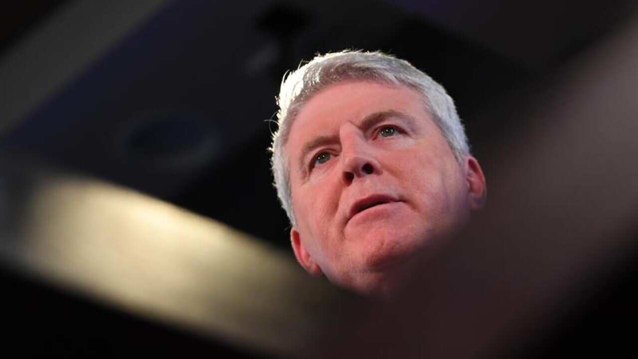 Brendan O'Connor looks on