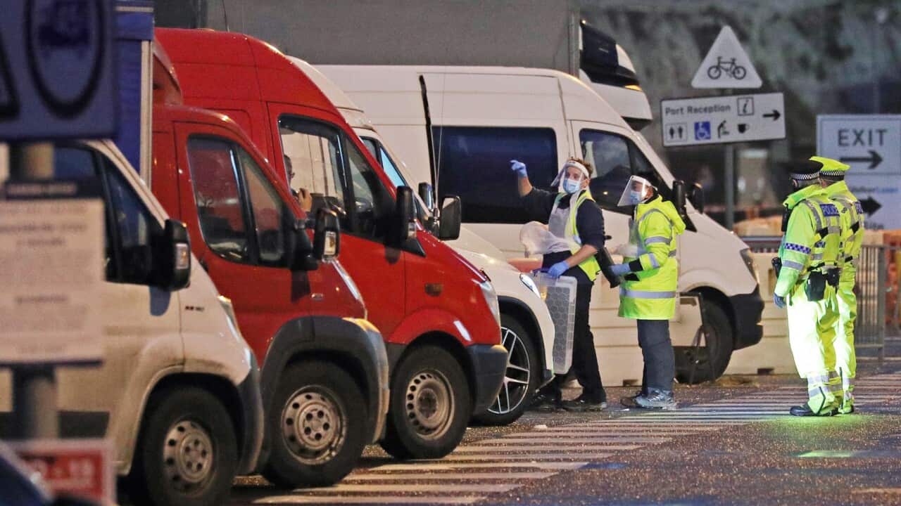 Testers prepare to take samples from drivers parked in the Port of Dover in Kent