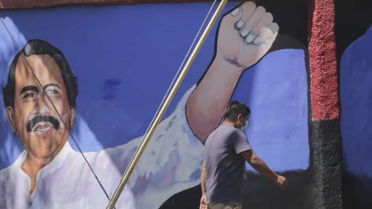 A man walks past a mural of Nicaraguan President Daniel Ortega during general elections in Managua, Nicaragua, 7 November 2021.