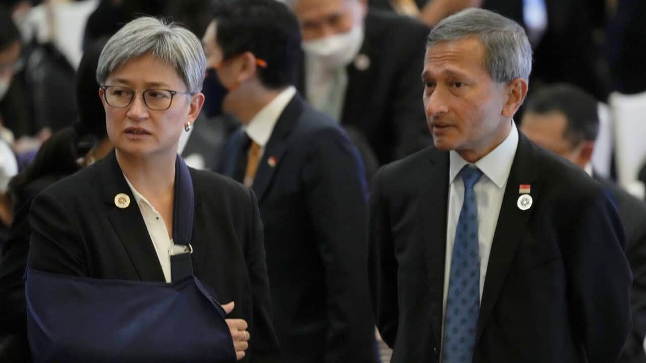 Australia's Foreign Minister Penny Wong, left, talks with Singapore Foreign Minister Vivian Balakrishnan during ASEAN - Australia Foreign minister Meeting in Phnom Penh, Cambodia, Thursday, Aug. 4, 2022.