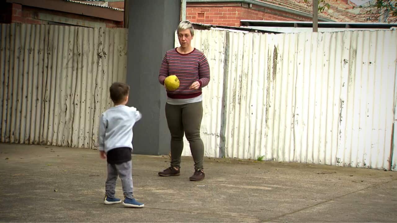 Laura playing with her son (SBS).jpg