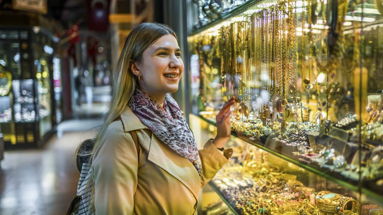 Woman looking at a jewelry store window