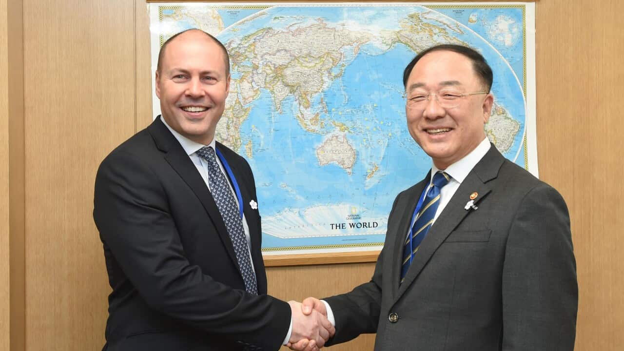 Treasurer Josh Frydenberg discusses with his Korean counterpart Deputy Prime Minister and Finance Minister Hong Nam-ki in Washington.