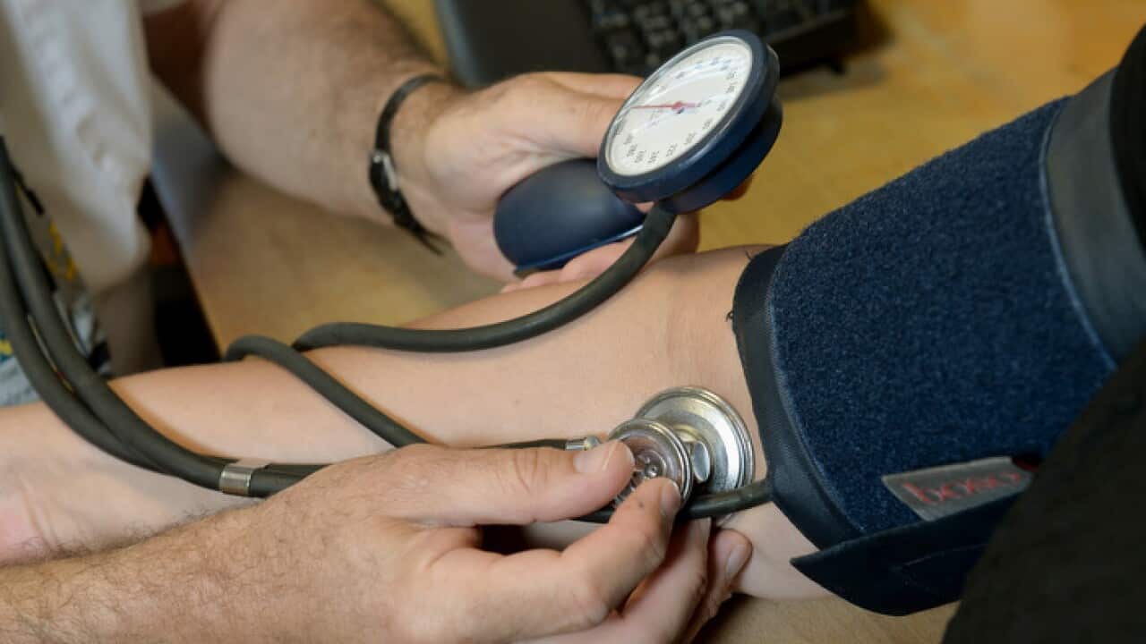 Dr Laurence Buckman checks a patient's blood pressure in his practice room at the Temple Fortune Health Centre GP Practice near Golders Green, London.. Picture date: Wednesday September 10, 2014. Photo credit should read: Anthony Devlin/PA Wire