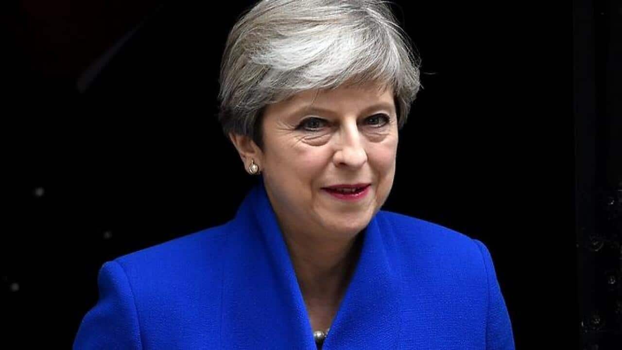 Britain's Prime Minister Theresa May leaves No. 10 Downing Street to meet the Queen in Buckingham Palace, in London