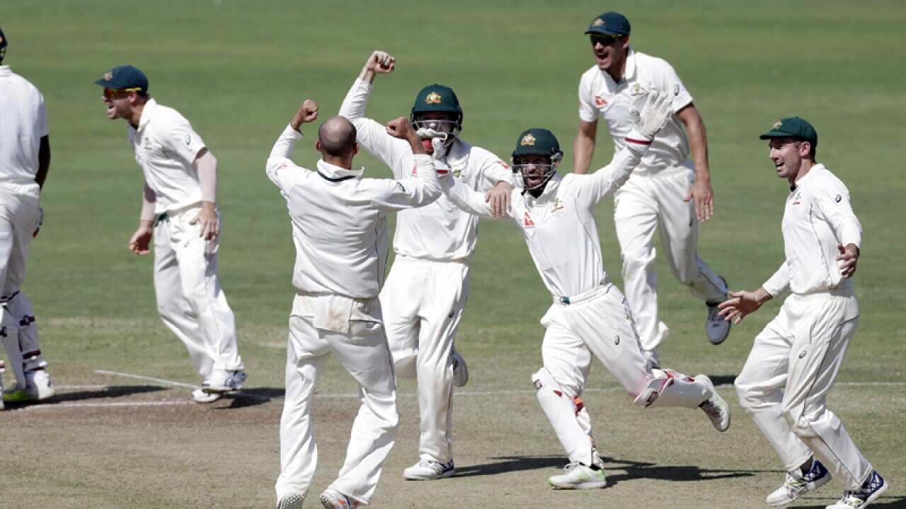 Australia's captain Steve Smith, left, and teammates celebrate
