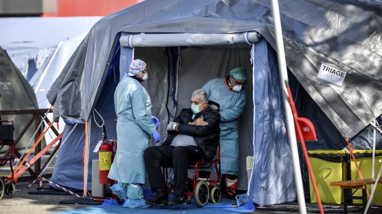 An elderly patient in an emergency structure that was set up to ease procedures outside the hospital of Brescia, Northern Italy