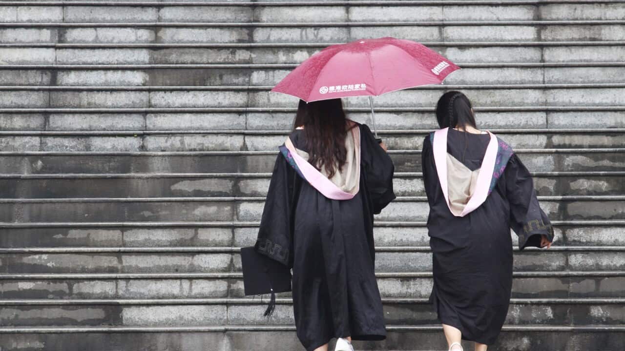 Femle students pose for graduating photograph in China