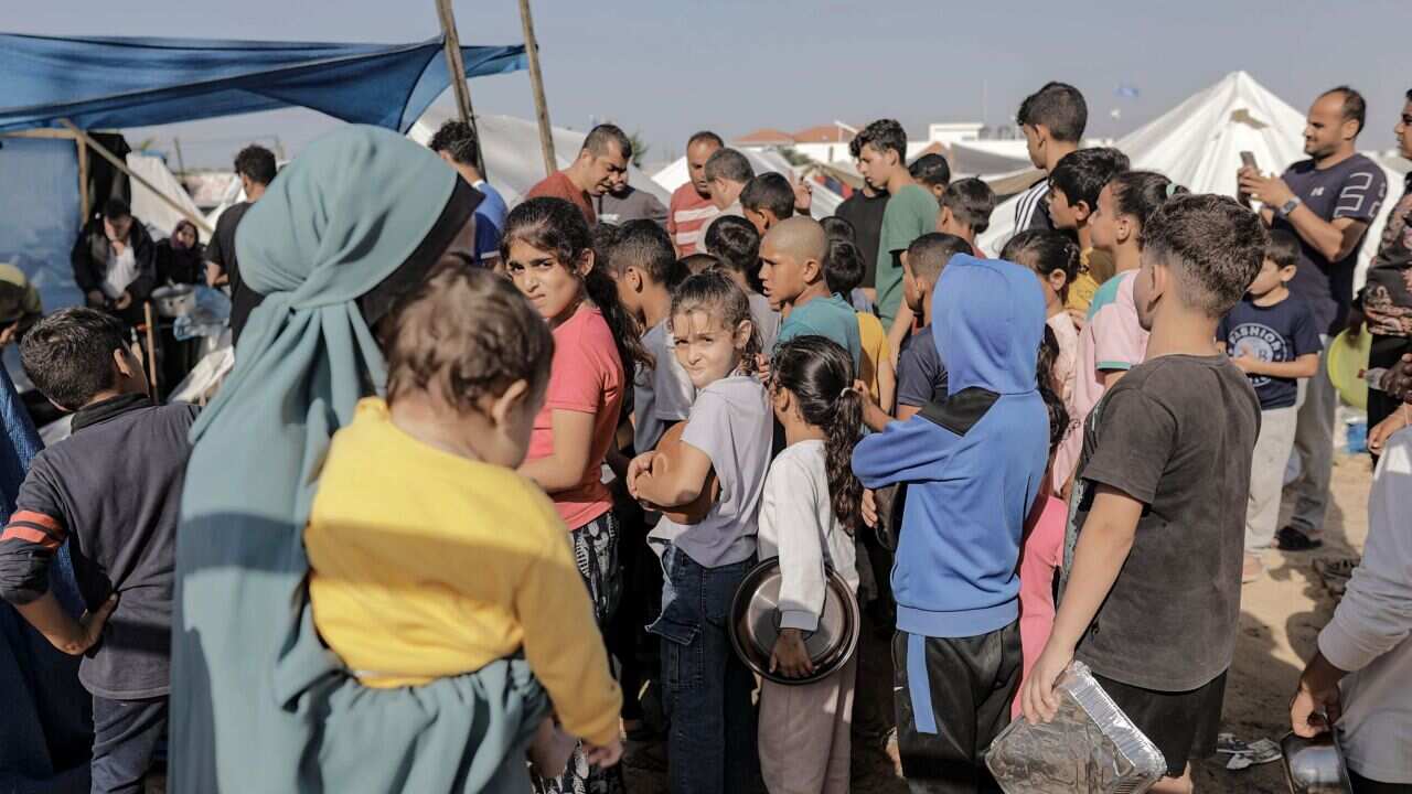 Children queue for food