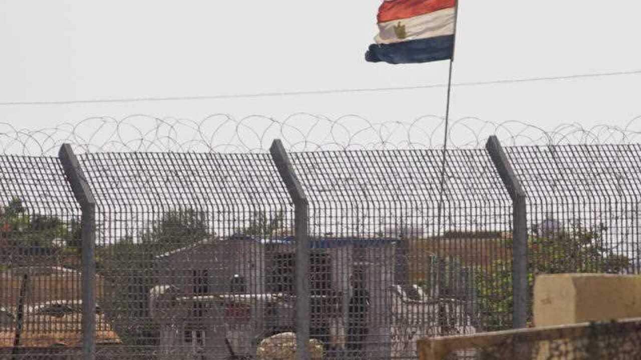 An Egyptian military officer watches at a post in Egypt's northern Sinai Peninsula, as seen from the Israel-Egypt border, in Kerem Shalom village, southern Israel, Wednesday, July 1, 2015. (AAP)