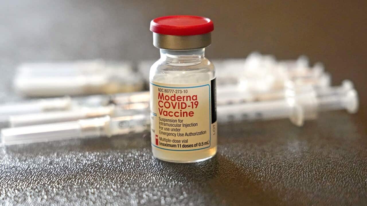 A vial filled with the Moderna COVID-19 vaccine