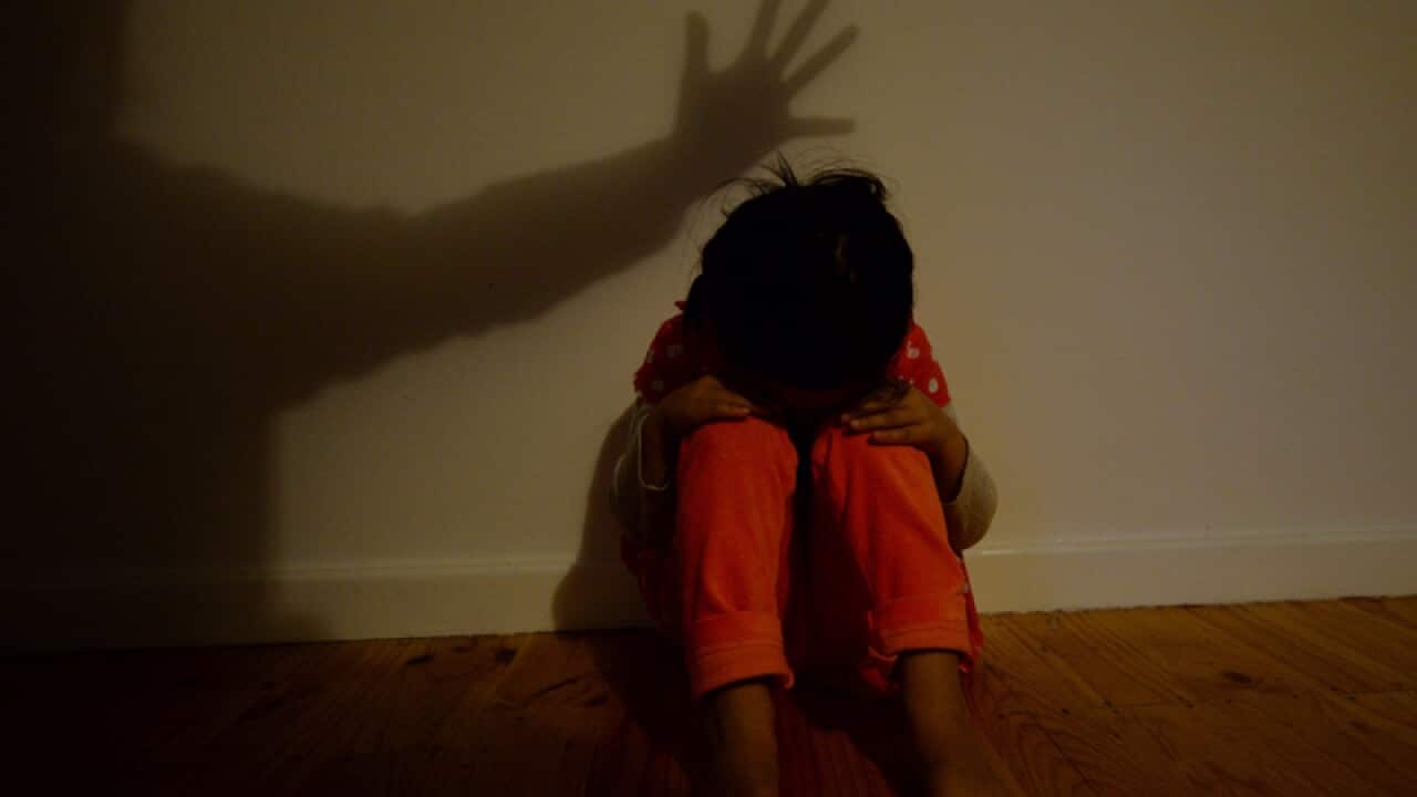 A little girl poses to illustrate the topic of child abuse