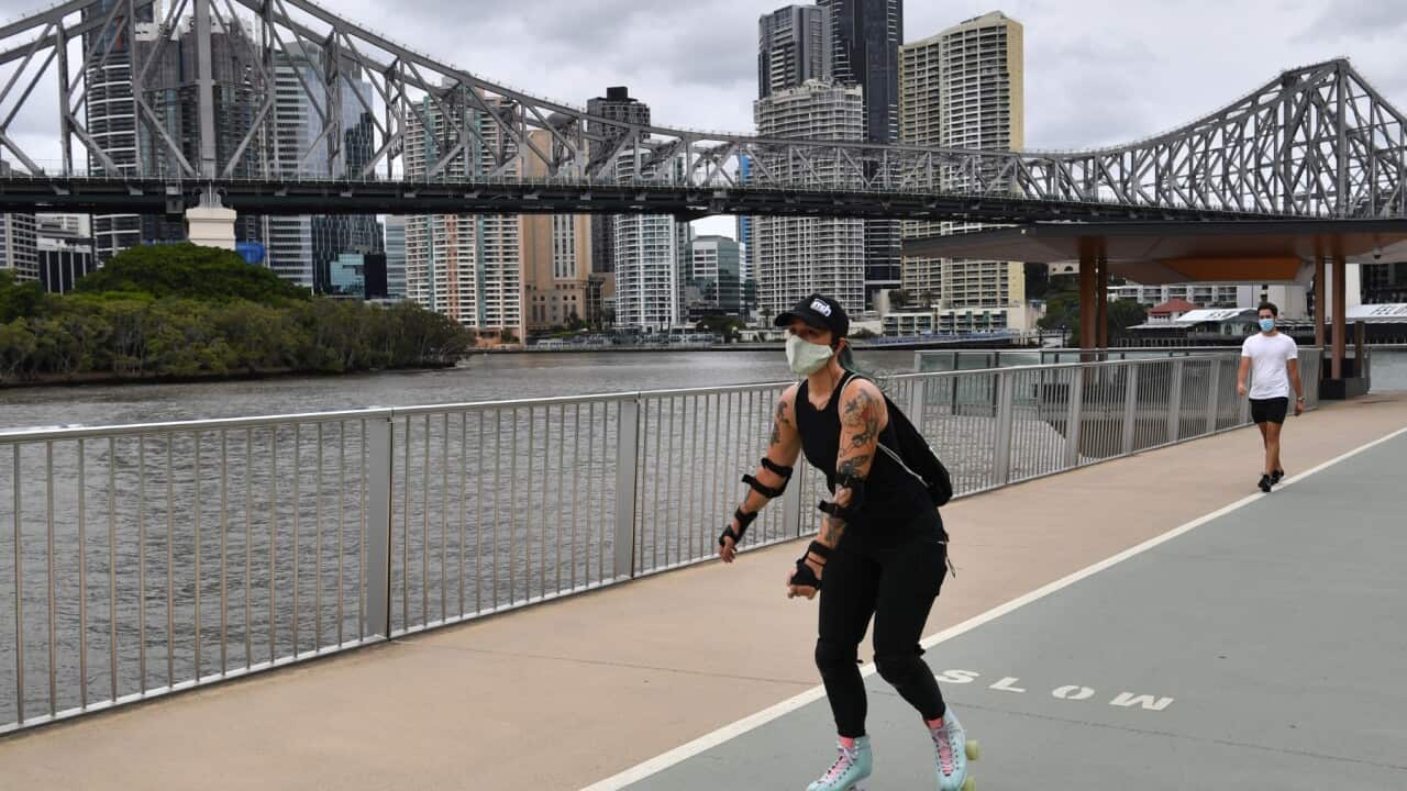 A women on roller-skates is seen exercising along the New Farm Riverwalk in Brisbane, Saturday, January 9, 2021. Residents of Greater Brisbane face mandatory lockdown over the weekend in a bid to contain the highly contagious UK variant of COVID-19.
