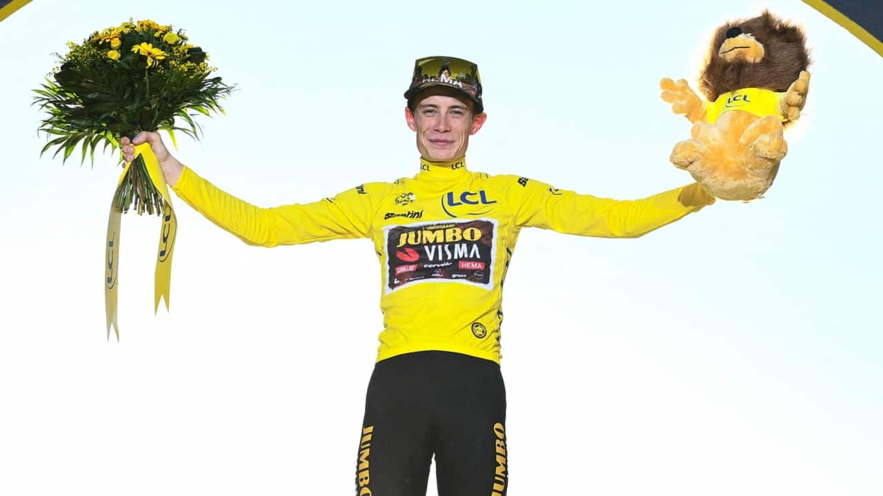 Jonas Vingegaard (Jumbo-Visma) celebrates after winning the 2022 Tour de France