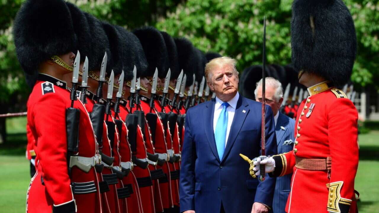 US President Donald J. Trump, Britain's Charles, The Prince of Wales and Captain of the Guard Major Hamish Hardy at Buckingham Palace, in London.
