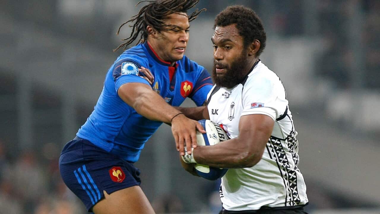 France's Teddy Thomas, left, with Fiji's Apisalome Ratuniyawara