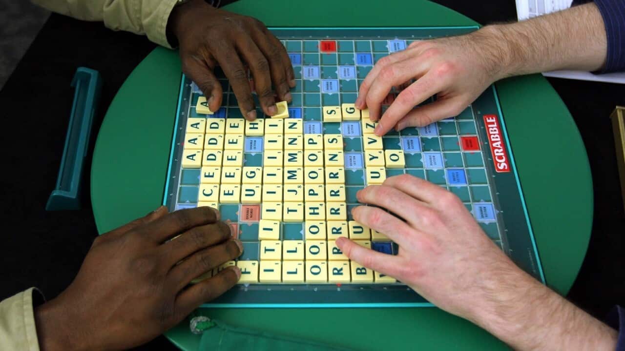People playing Scrabble.