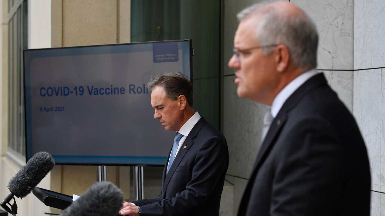Minister for Health Greg Hunt and Prime Minister Scott Morrison at a press conference at Parliament House in Canberra. Friday, April 9, 2021. (AAP Image/Mick Tsikas) NO ARCHIVING