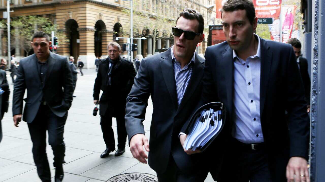 Cronulla Sharks player John Morris makes no comment after leaving his lawyers office in Sydney, Wednesday, Aug. 20, 2014. (AAP)
