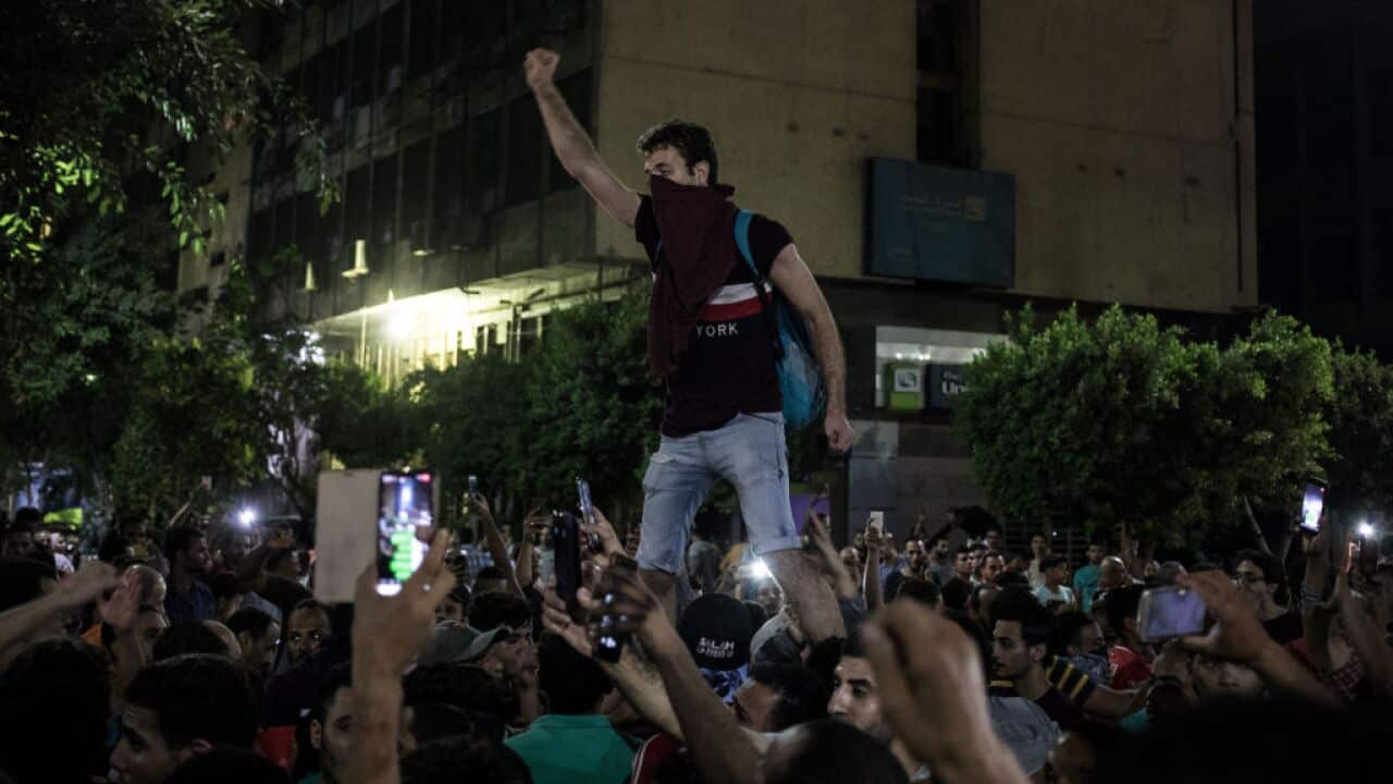 Protesters shout slogans during a rare anti-government protest in Downtown Cairo.