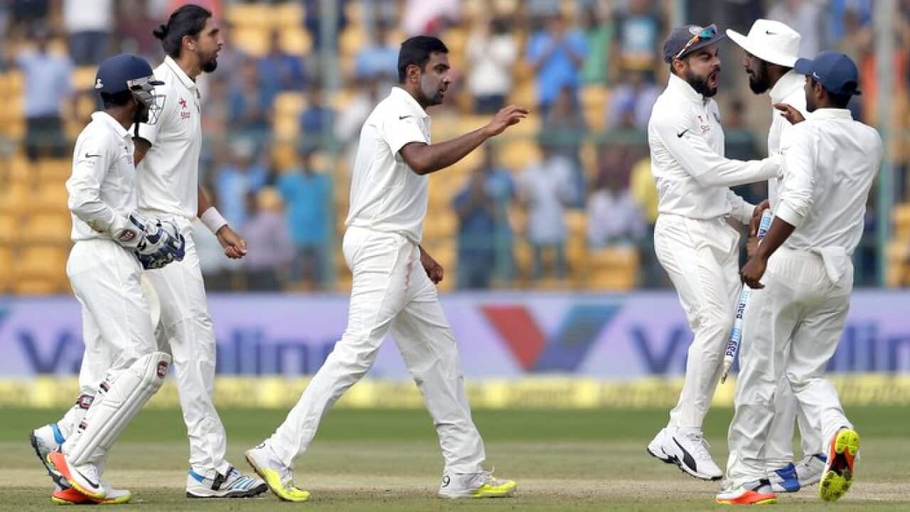 Indian players celebrate their win over Australia on the fourth day of their second test cricket match in Bangalore, India, Tuesday, March 7, 2017. Indian won the match by 75 runs. (AP Photo/Aijaz Rahi)