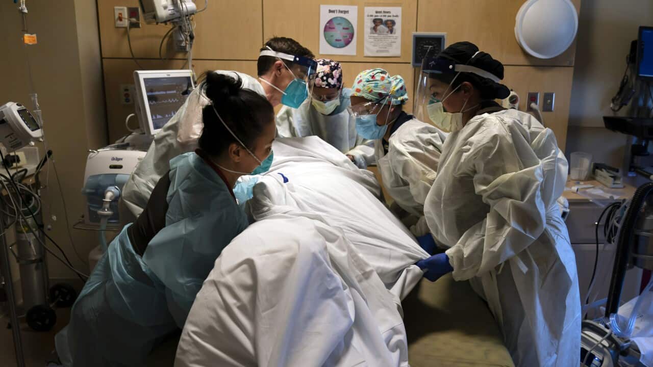 A file photo of medical staff caring for a COVID-19 patient at Providence Holy Cross Medical Center in Los Angeles, 19 November, 2020.