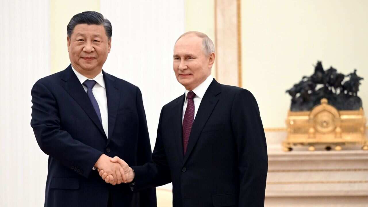 The leaders of China and Russia shake hands (AAP).jpg
