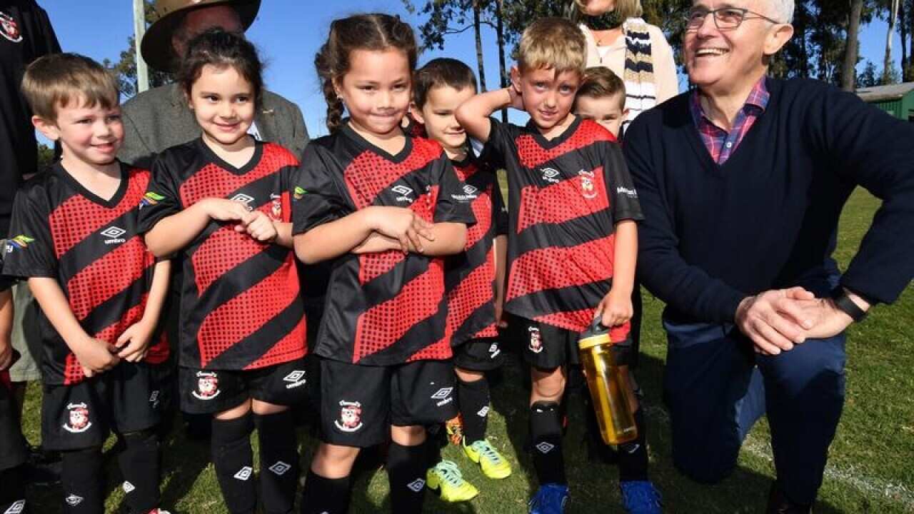 Malcolm Turnbull with Caboolture under 6 soccer players in Longman.