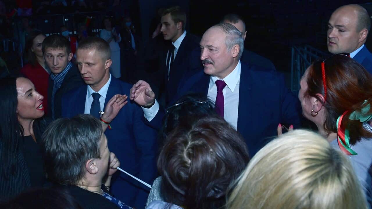 President Alexander Lukashenko chats with supporters at a women's forum in Minsk