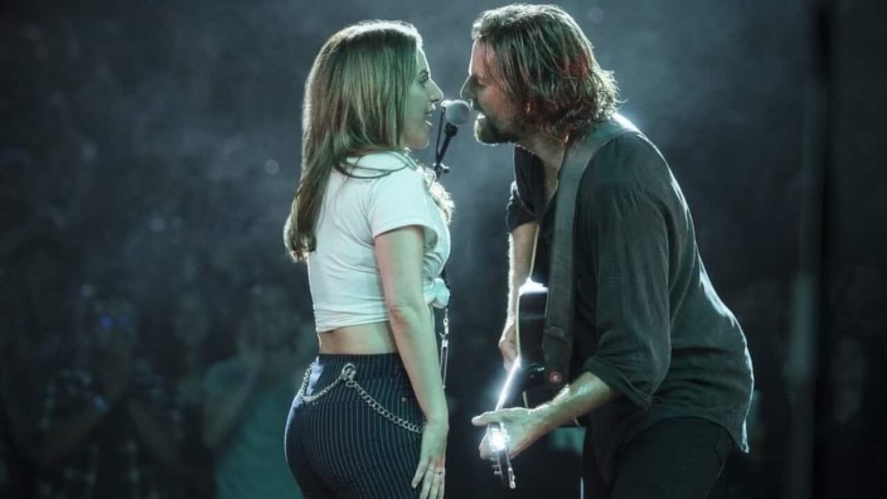 Pictures shows Lady Gaga, left, and Bradley Cooper in a scene from "A Star is Born." (Clay Enos/Warner Bros. Pictures via AP)