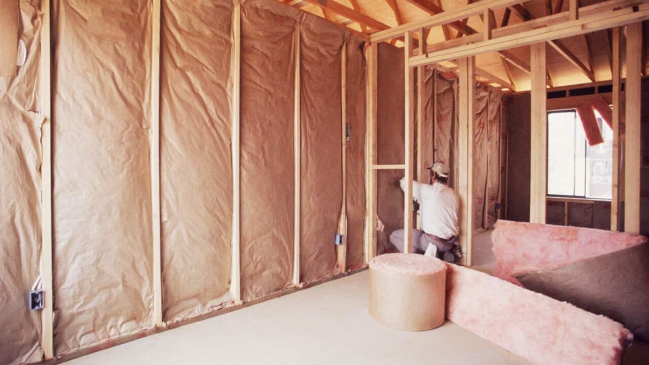thumbnail_Installing insulation into wall of new home (Getty).jpg