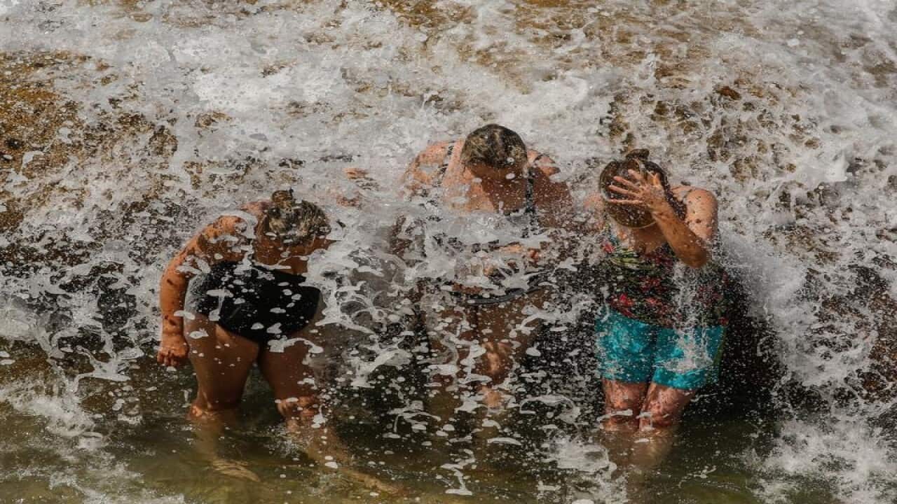 Beachgoers cooling off on Tamarama Beach in Sydney