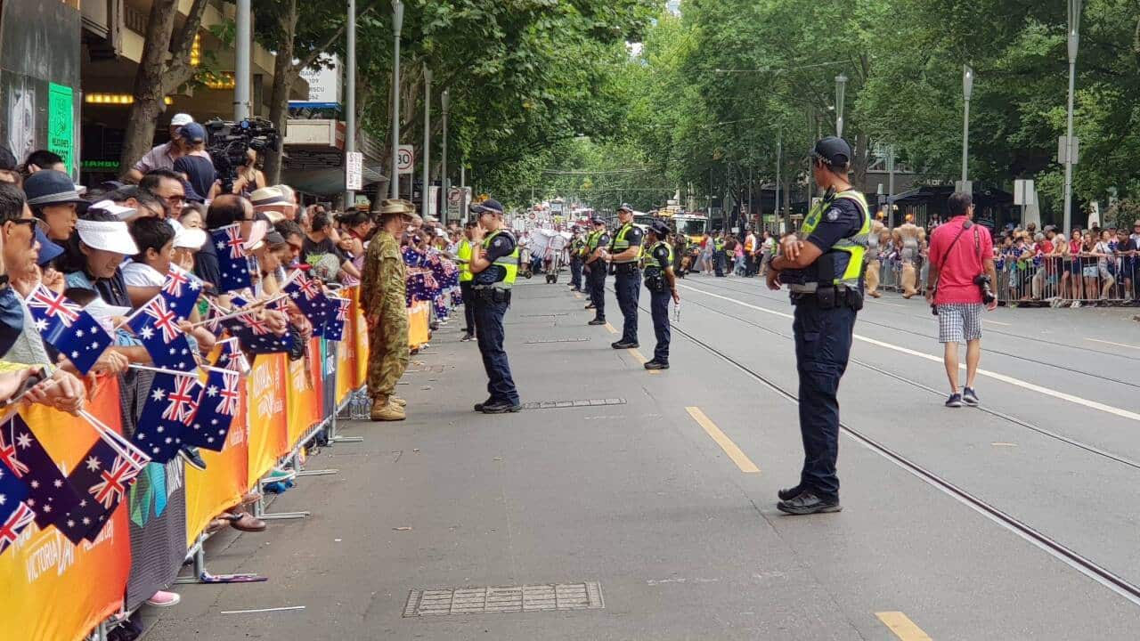 Multicultural crowd and number of policemen seen as Australia day parade in Melbourne commence. 26 Jan 2018
