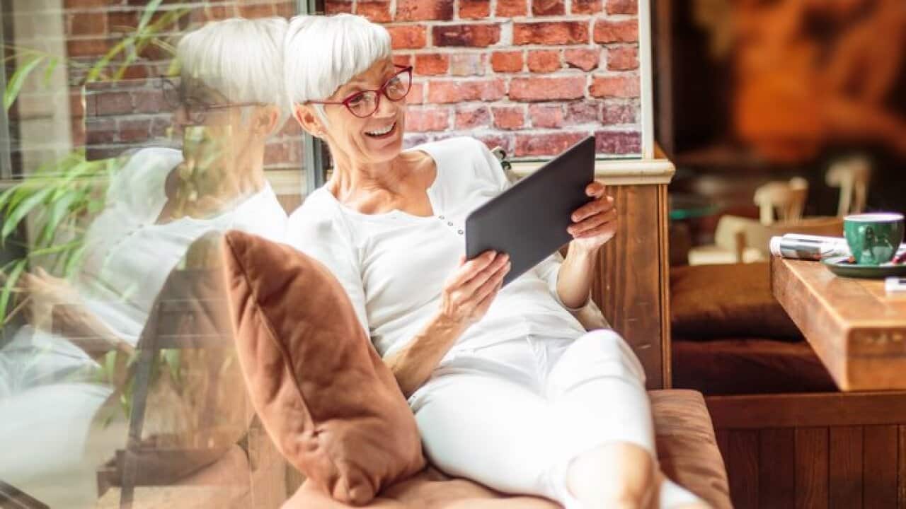 Senior woman with digital tablet