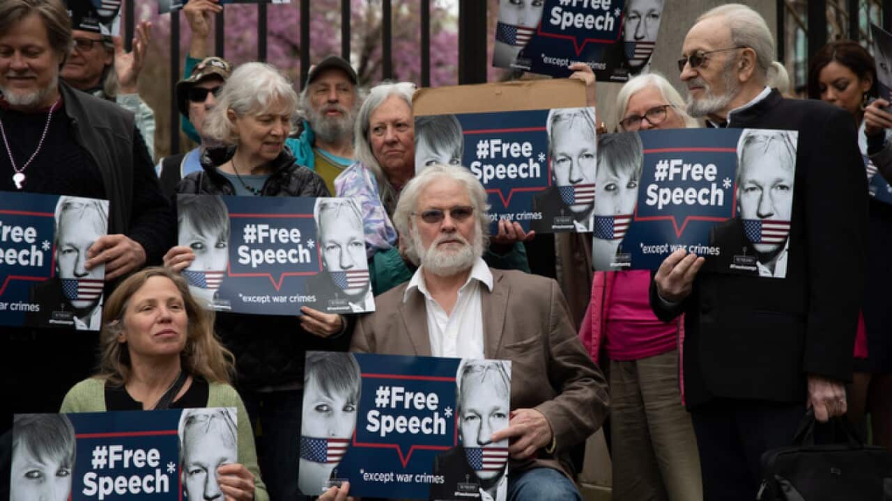 Supporters of Wikileaks founder Julian Assange protest outside the British Embassy in Washington, DC.