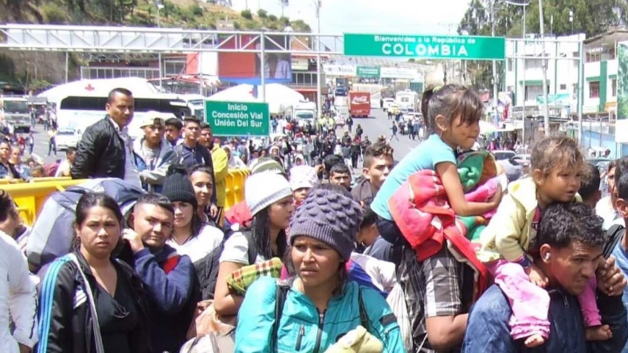 Migrantes venezolanos en la frontera entre Ecuador y Colombia