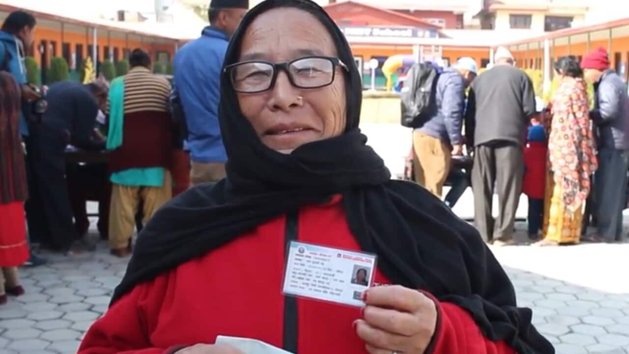 A Nepali voter with her voter identification card in Kathmandu.
