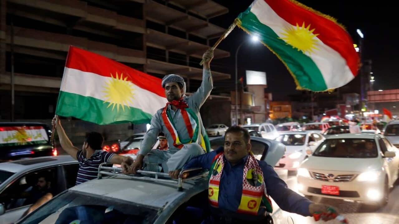 Kurds celebrate after the announcement of the results of the independence referendum in Erbil