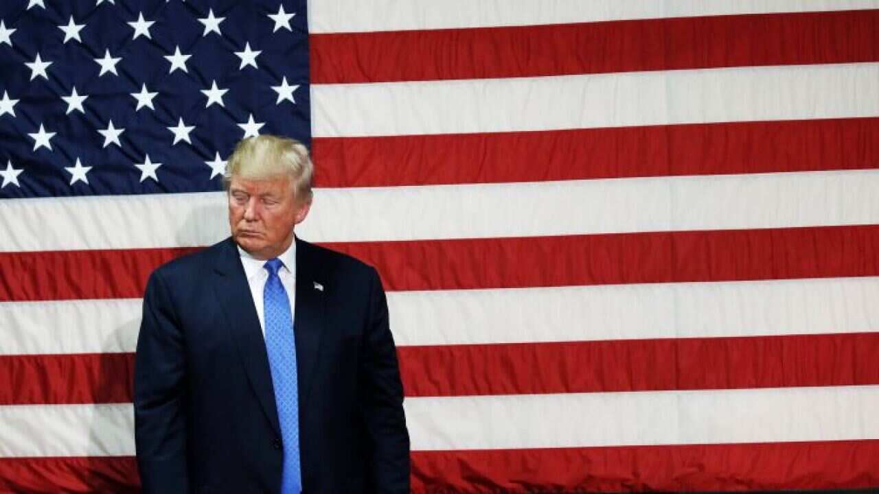 Republican presidential nominee Donald Trump pauses as he speaks at a campaign town hall event in Sandown, New Hampshire, U.S., October 6, 2016.