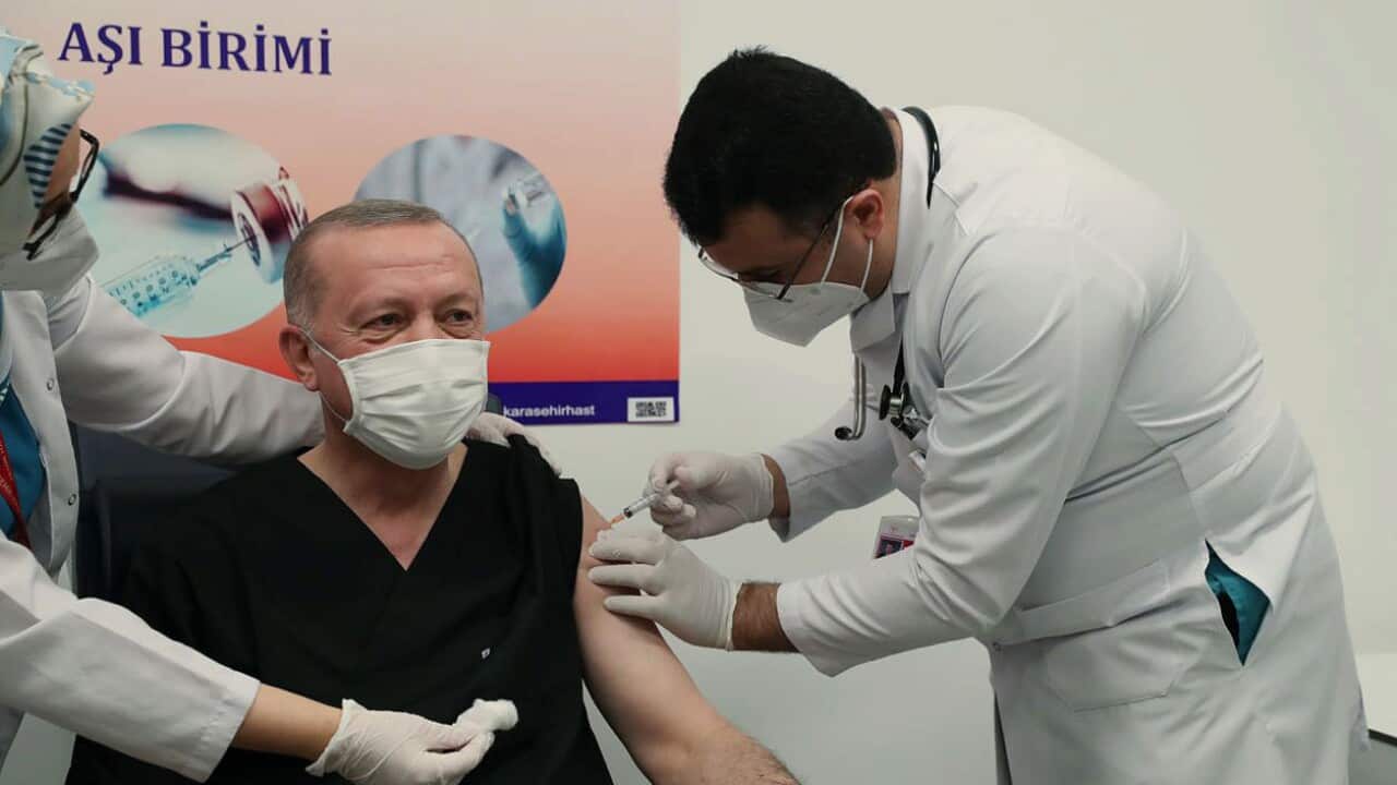 Turkey's President Recep Tayyip Erdogan receives the COVID-19 vaccination