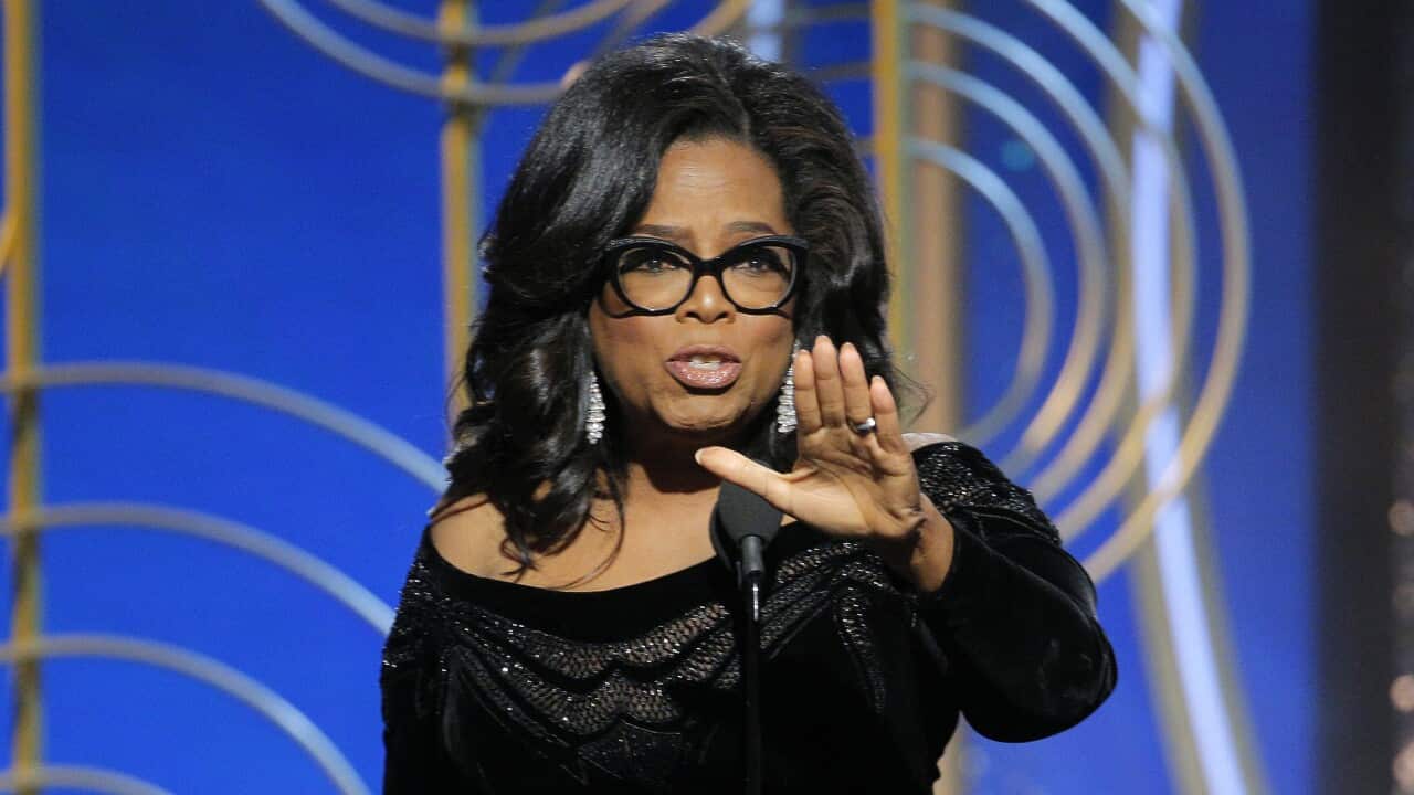 This image released by NBC shows Oprah Winfrey accepting the Cecil B. DeMille Award at the 75th Annual Golden Globe Awards in Beverly Hills, Calif., on Sunday, Jan. 7, 2018. (Paul Drinkwater/NBC via AP)