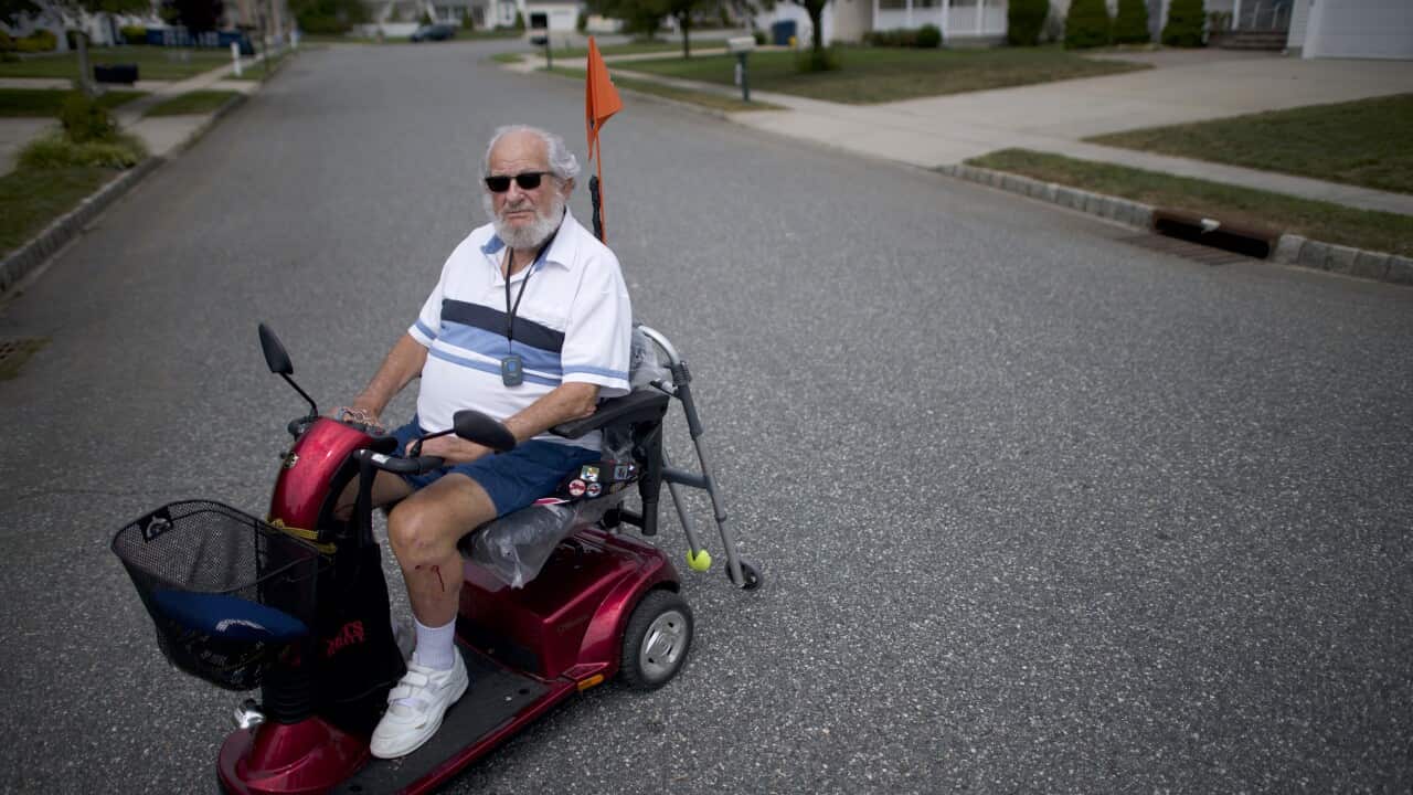Carl Abrams, 90, a retired Air Force Colonel rides his scooter around the neighborhood in Williamstown, N.J. on Aug. 28, 2019. (Mark Makela/The New York Times)