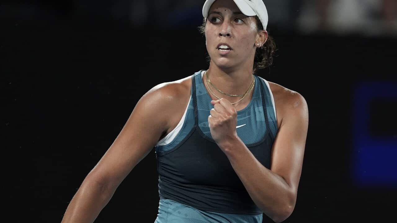 A tennis player clencing their fist.