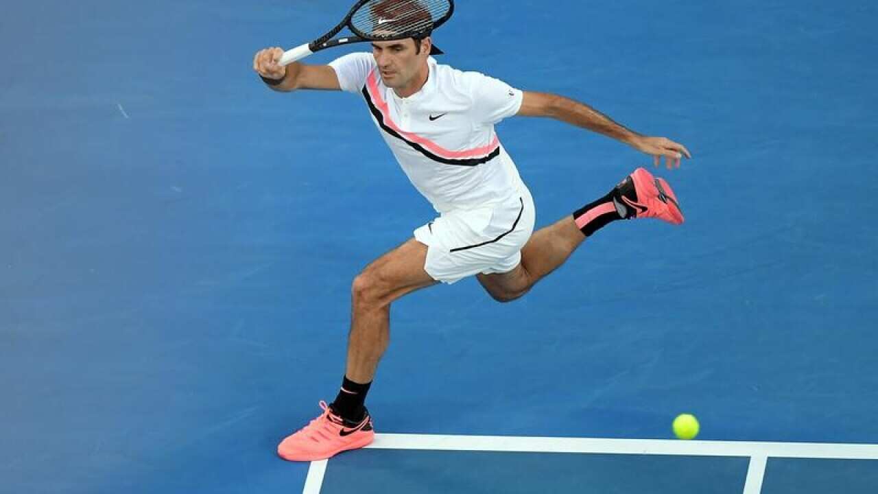 Roger Federer of Switzerland in action against Aljaz Bedene.