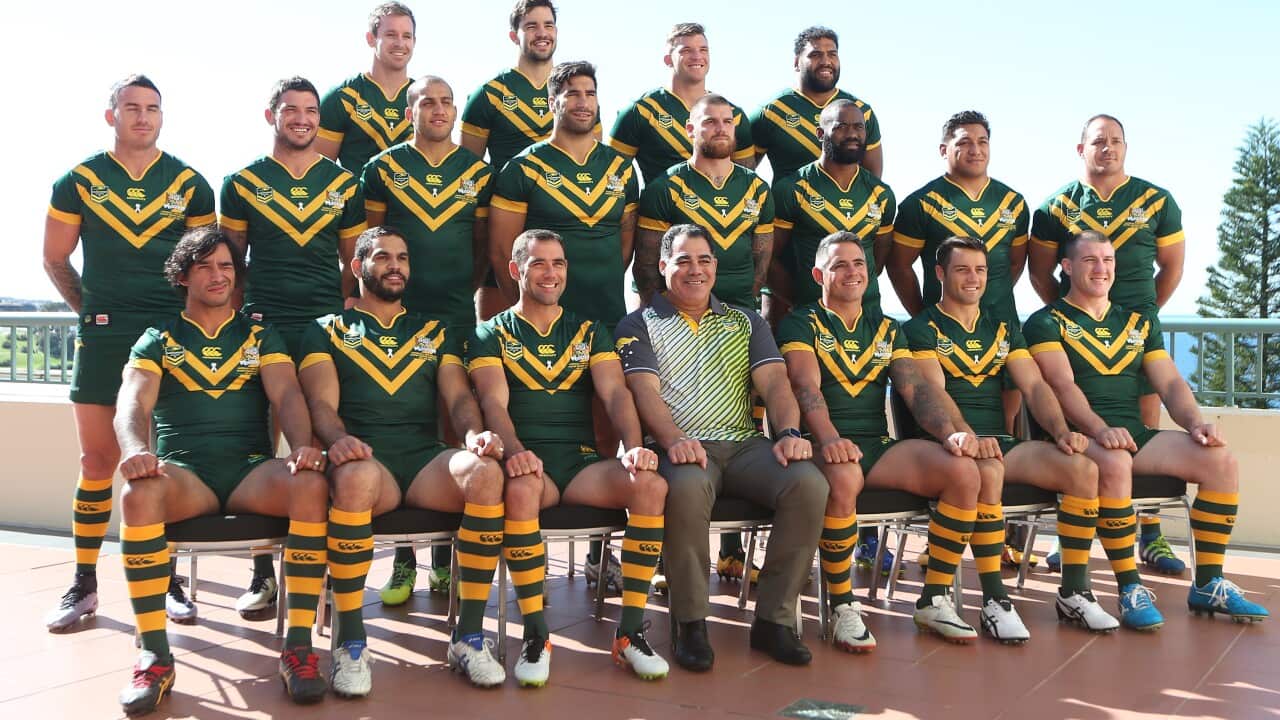 The Australian Kangaroos team pose for a photograph with coach Mal Meninga (front row centre) at Coogee beach in Sydney, Monday, May 2, 2016. (AAP Image/David Moir) NO ARCHIVING, EDITORIAL USE ONLY