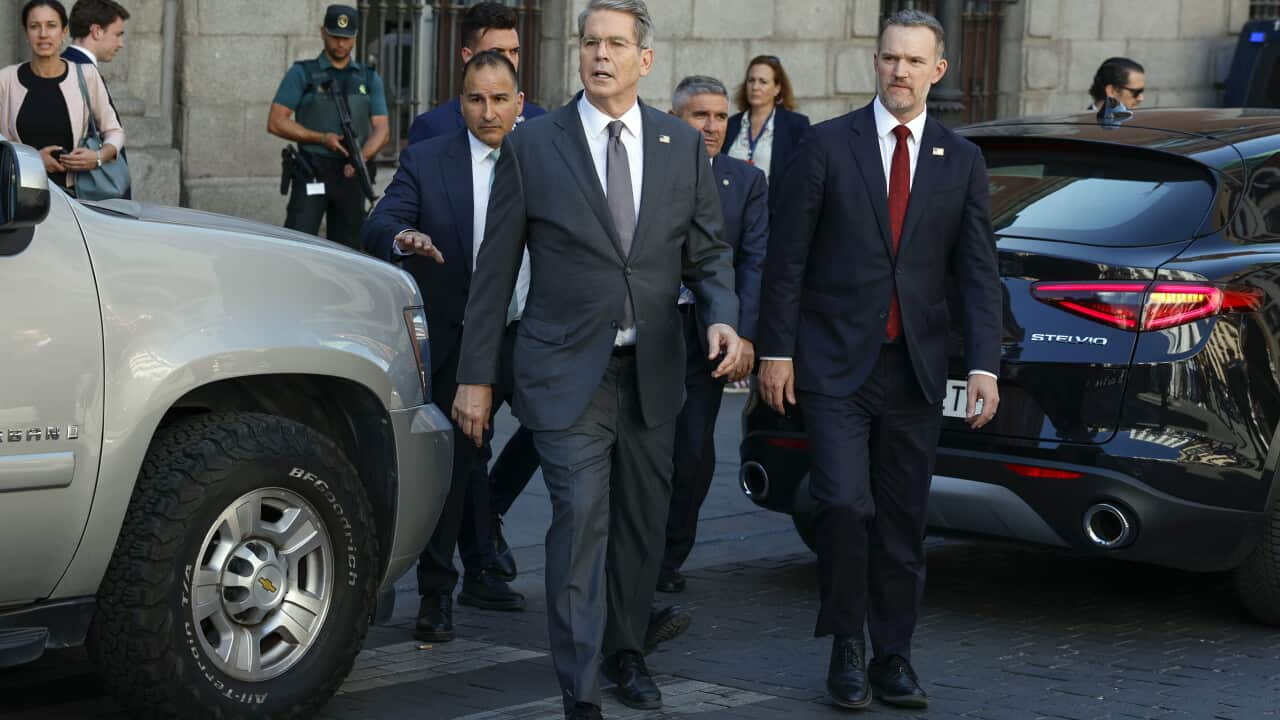 US Treasury Secretary Scott Bessent walking along a street
