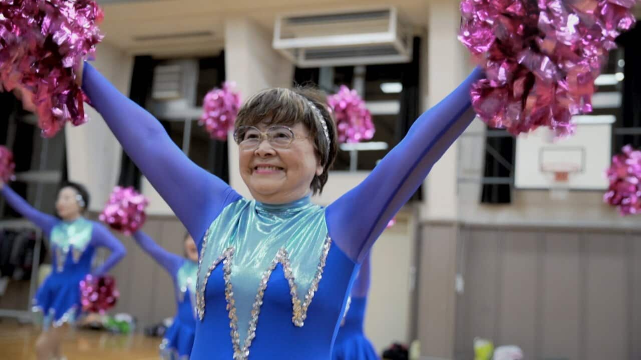 Fumie Takino cheerleading with her team, Japan Pom Pom.