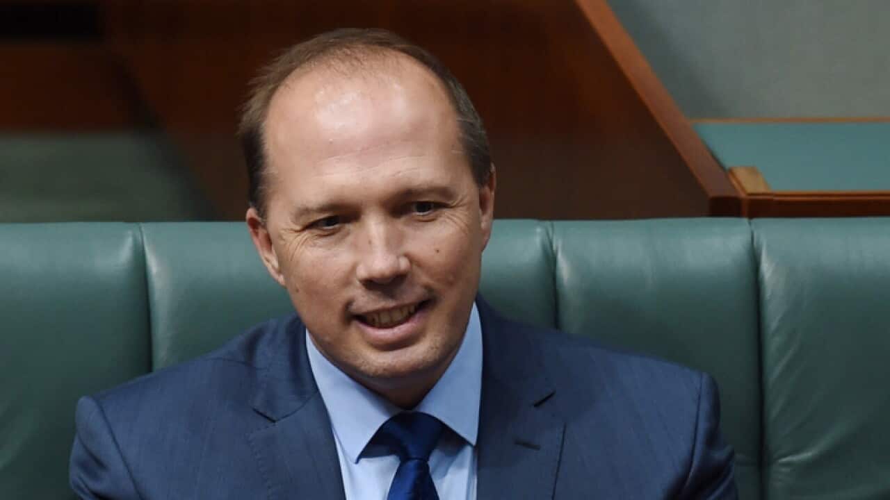 Australian Minister for Immigration and Border Protection Peter Dutton reacts during House of Representatives Question Time at Parliament House in Canberra, Tuesday, Nov. 22, 2016. (AAP Image/Lukas Coch) NO ARCHIVING